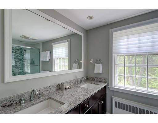 47 Draper Road Wayland, MA 01778 - Photo 19 of 26 a bathroom with a granite countertop sink and a large mirror