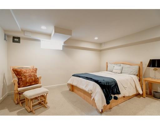 47 Draper Road Wayland, MA 01778 - Photo 23 of 26 a bedroom with a bed and a chair