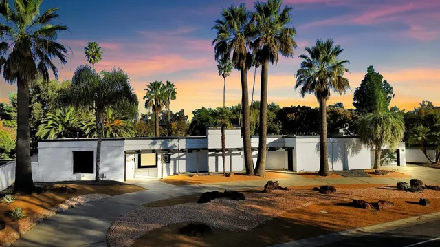 a view of a swimming pool with a patio