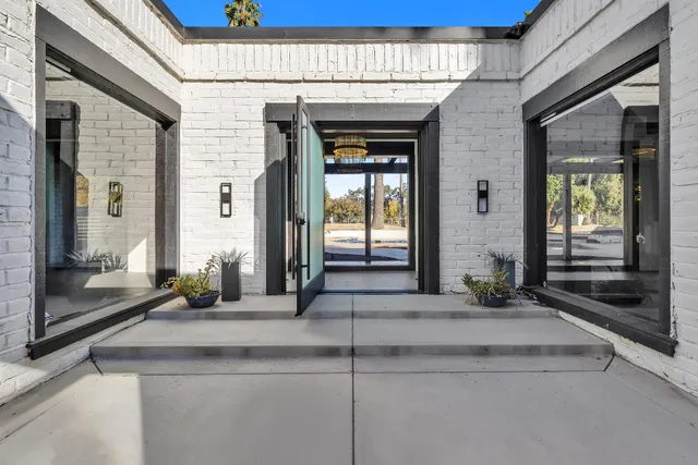a view of living room and wooden floor
