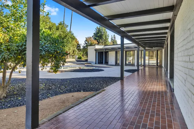 a kitchen with stainless steel appliances kitchen island a stove and a sink