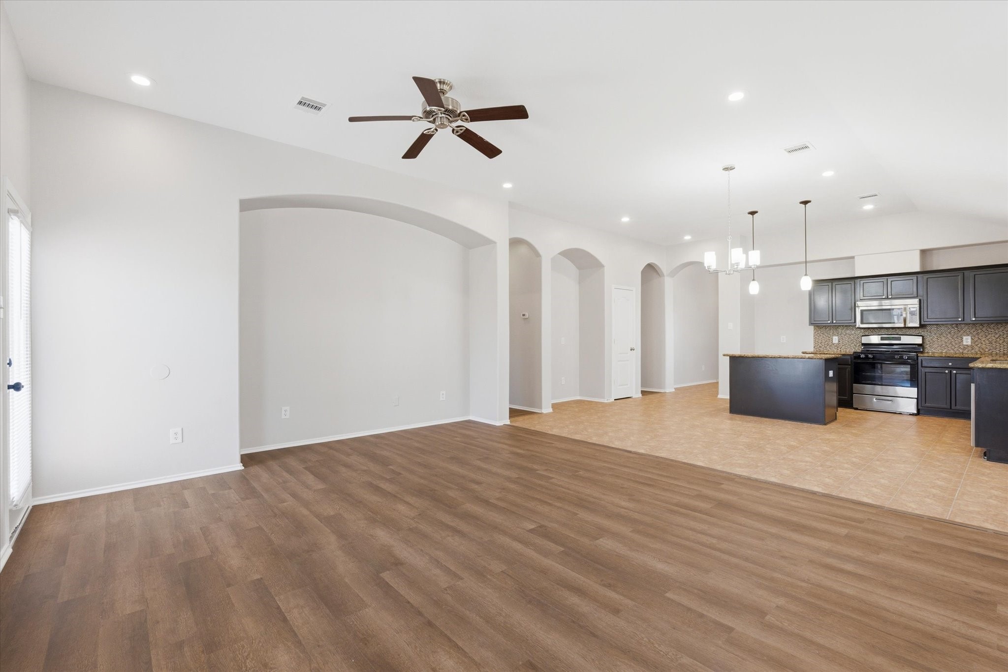4506 Prince Street Baytown, TX 77521 - Photo 11 of 26 Large living room open to kitchen!