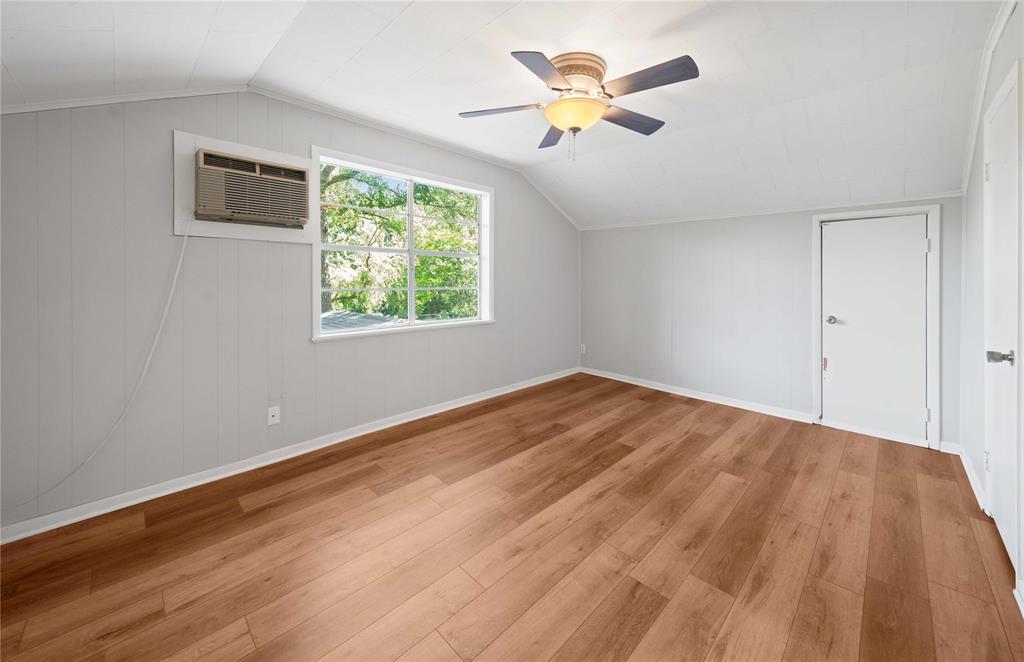 216 Pinewood Lane Hideaway, TX 75771 - Photo 21 of 40 a view of empty room with wooden floor and fan