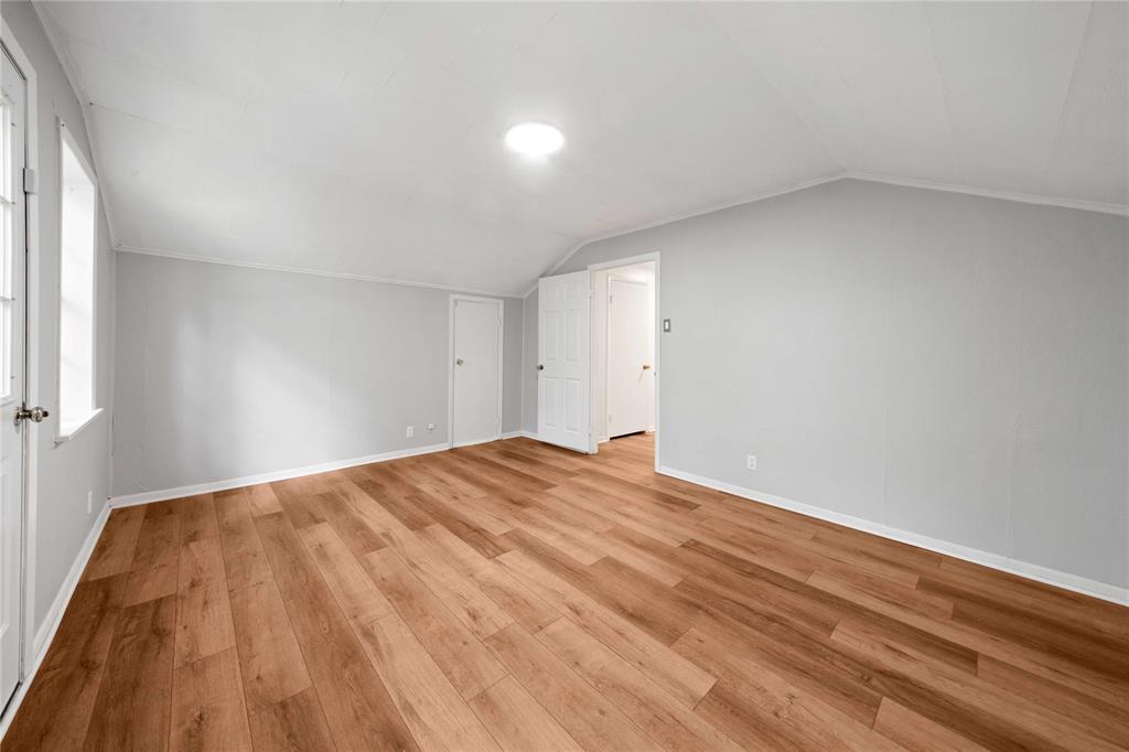 216 Pinewood Lane Hideaway, TX 75771 - Photo 25 of 40 a view of empty room with wooden floor