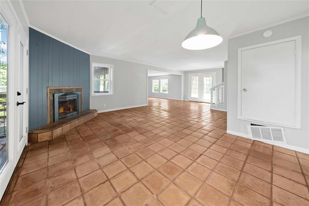 216 Pinewood Lane Hideaway, TX 75771 - Photo 10 of 40 a view of a livingroom with a chandelier fan and windows