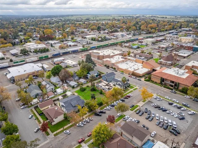 an aerial view of residential houses with outdoor space