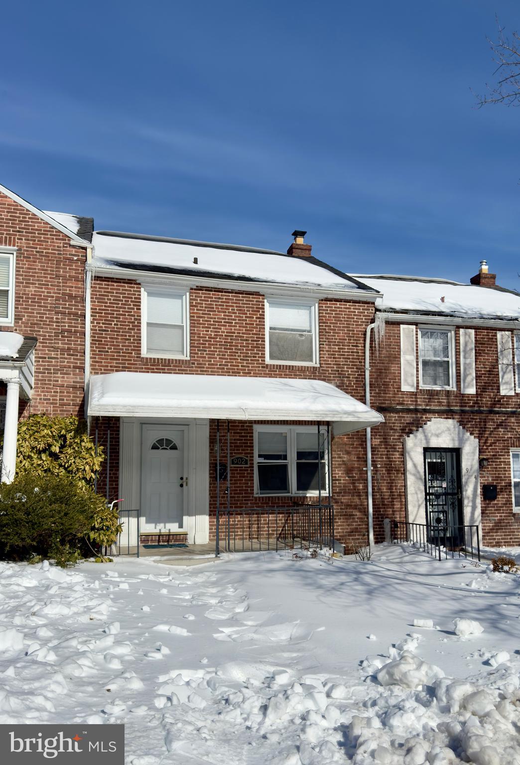 902 Andover Road Baltimore, MD 21218 - Photo 1 of 22 a front view of a house with a garden