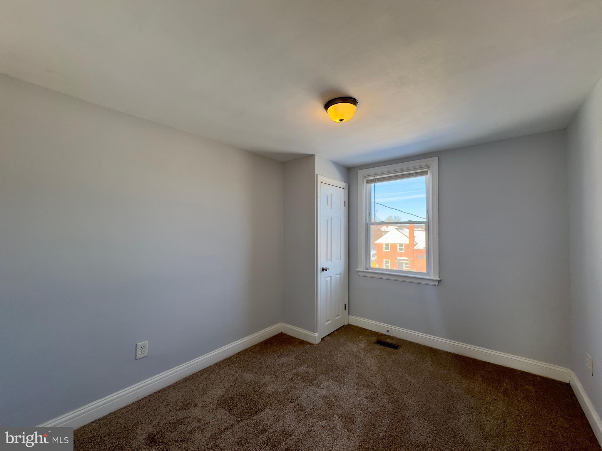 902 Andover Road Baltimore, MD 21218 - Photo 13 of 22 a view of an empty room with a window