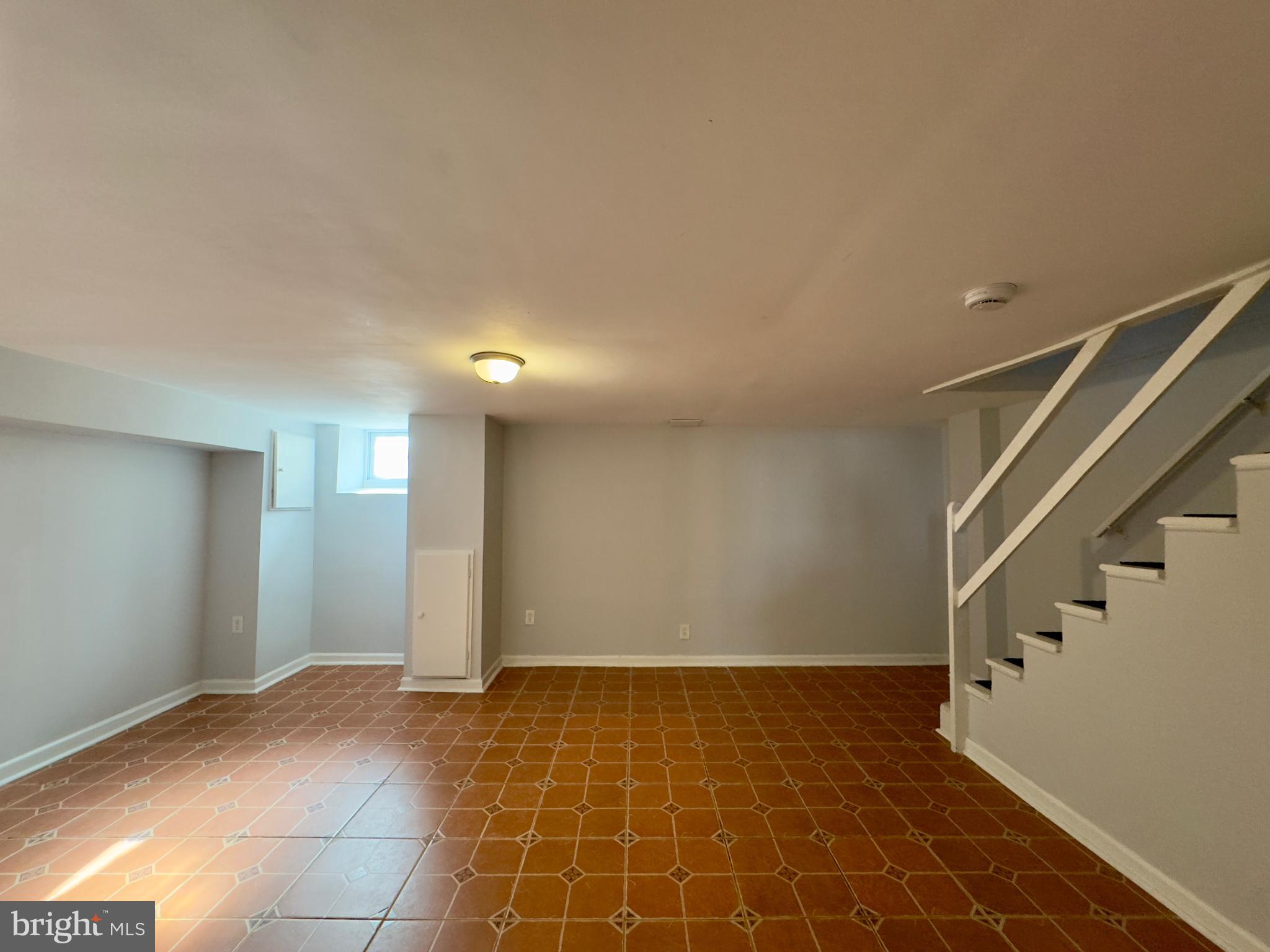902 Andover Road Baltimore, MD 21218 - Photo 14 of 22 a view of an empty room with stairs