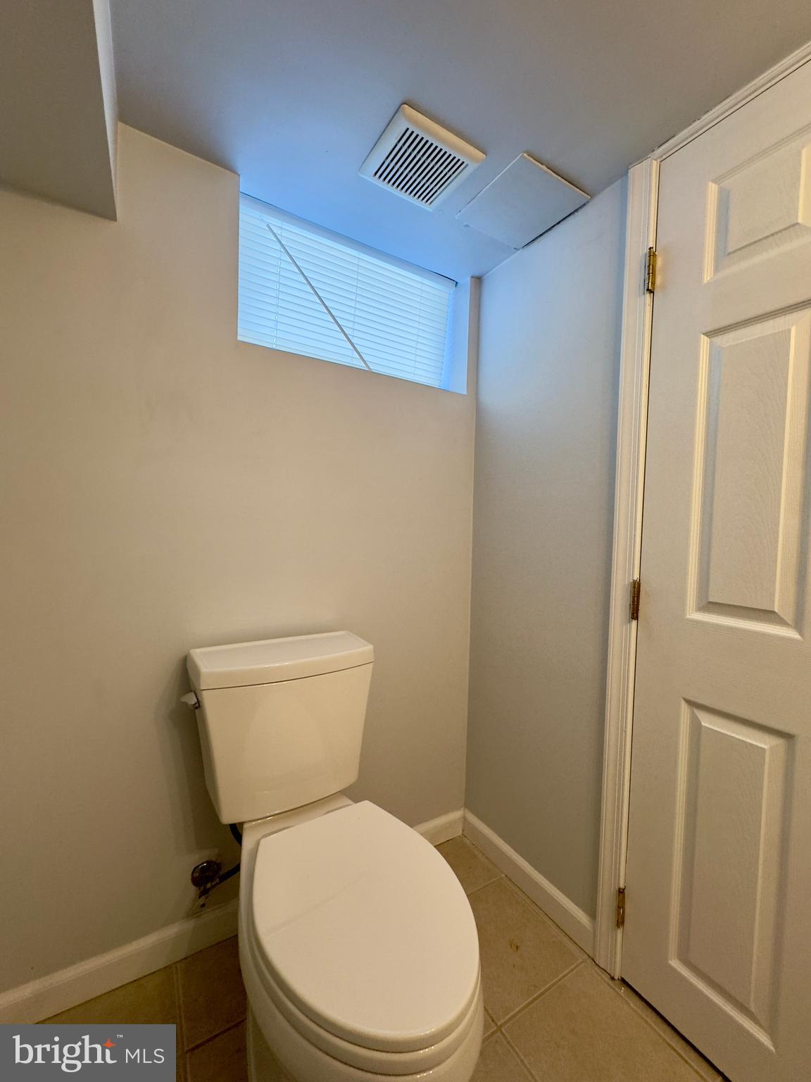 902 Andover Road Baltimore, MD 21218 - Photo 19 of 22 a white toilet sitting next to a shower