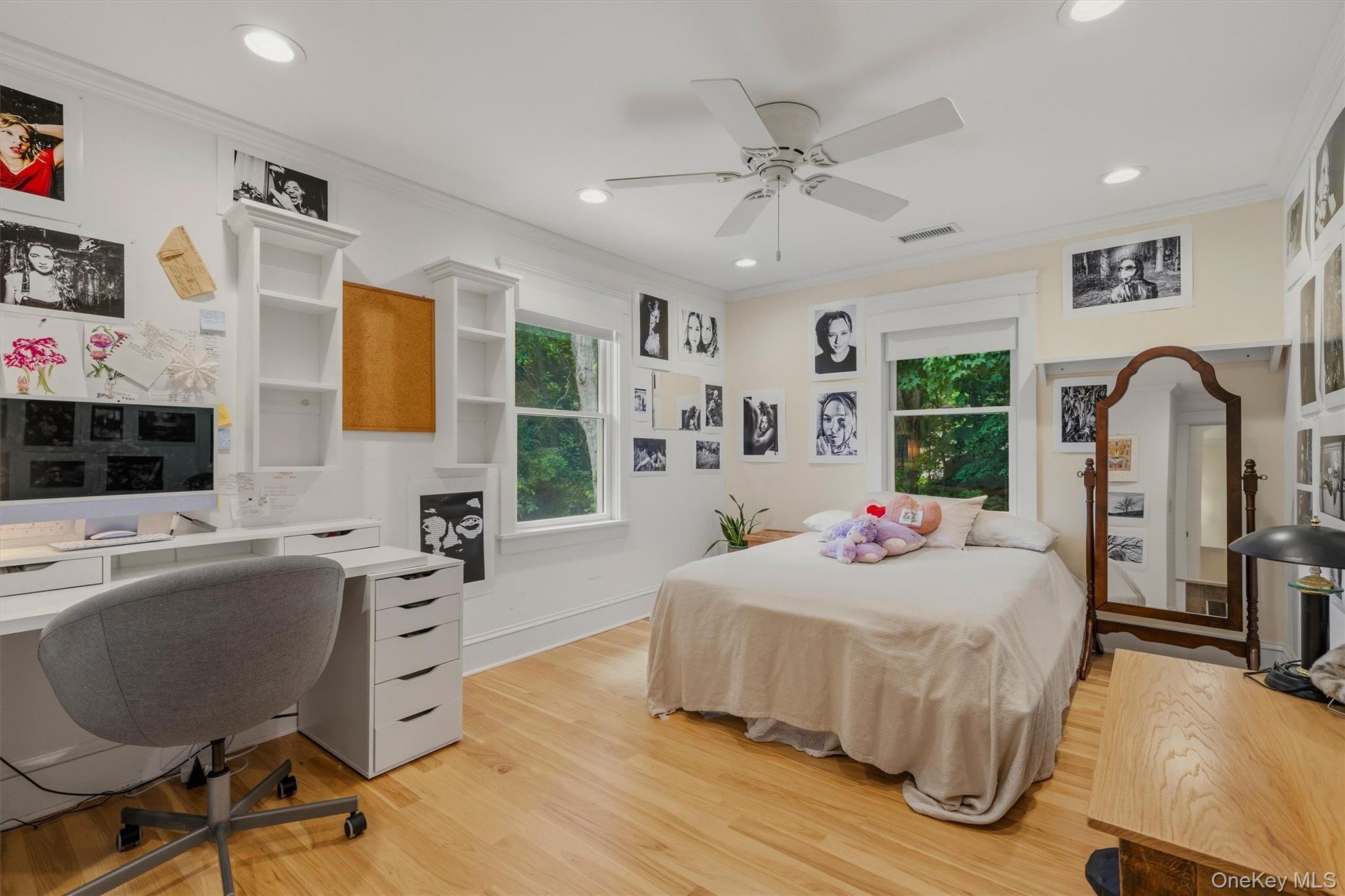 324 Haverstraw Road Suffern, NY 10901 - Photo 25 of 50 a bedroom with a bed dresser and a flat screen tv