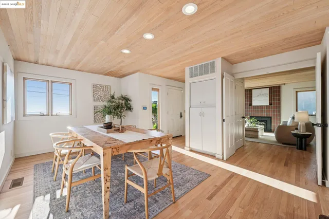 a view of a dining room with furniture and window