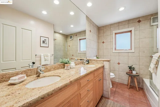 a living room with furniture a rug and a window