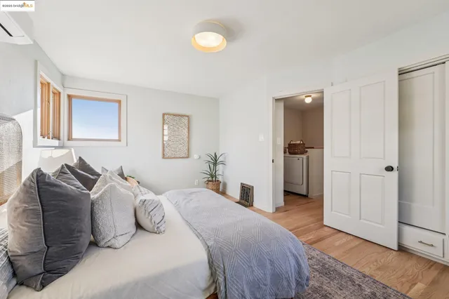 a bathroom with a granite countertop sink a mirror a bathtub and shower