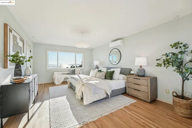 a bedroom with a large bed and a window