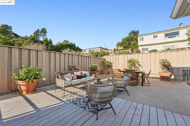 a view of a backyard with sitting area