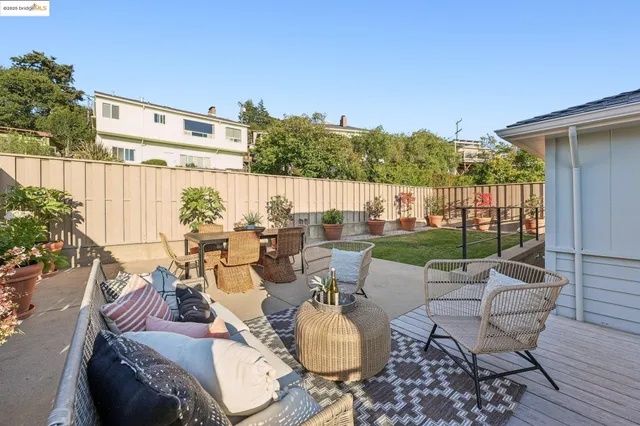 a view of backyard with a garden and deck