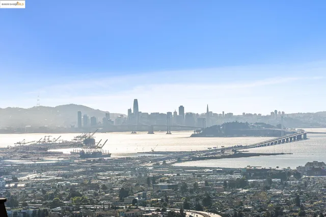 a view of a patio with table and chairs and potted plants