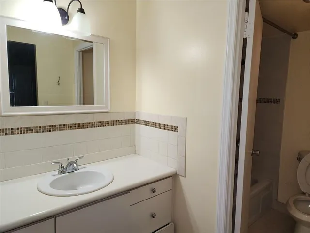 a bathroom with a sink and a toilet