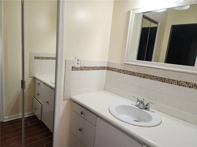 a bathroom with a sink and a mirror
