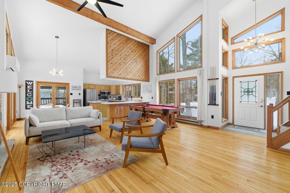 2260 Apley Court Bushkill, PA 18324 - Photo 43 of 44 a living room with furniture and floor to ceiling windows