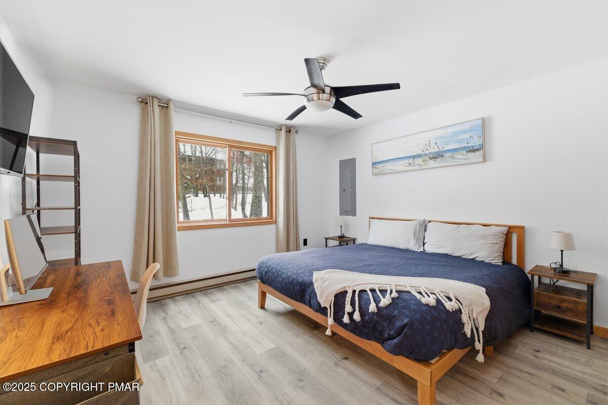 2260 Apley Court Bushkill, PA 18324 - Photo 12 of 44 a bedroom with a bed and wooden floor