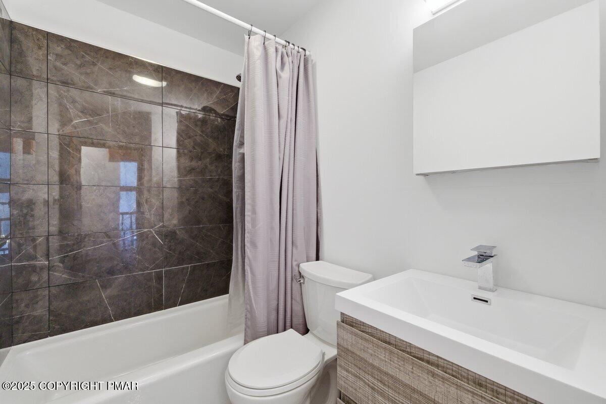 2260 Apley Court Bushkill, PA 18324 - Photo 16 of 44 a bathroom with a bathtub shower sink vanity and toilet
