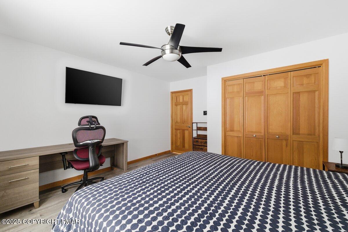 2260 Apley Court Bushkill, PA 18324 - Photo 18 of 44 a bedroom with a bed and a flat screen tv