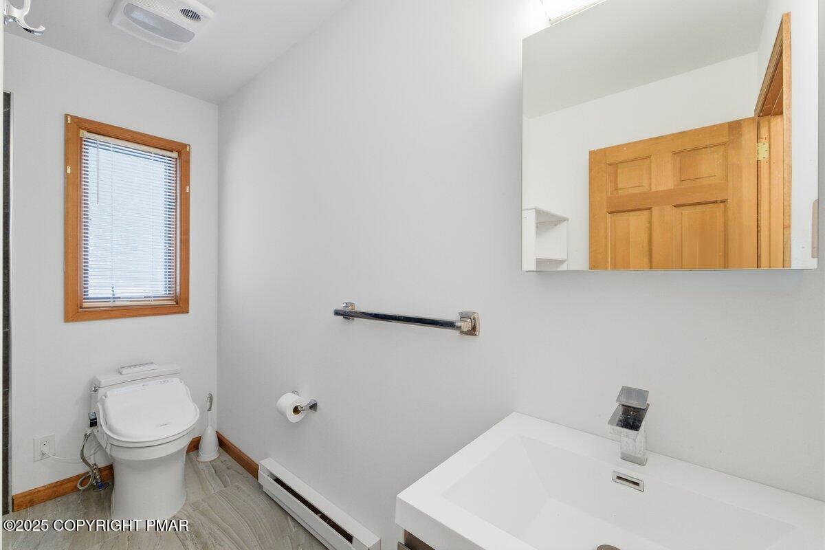 2260 Apley Court Bushkill, PA 18324 - Photo 20 of 44 a bathroom with a toilet sink and mirror