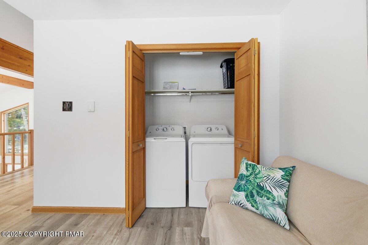 2260 Apley Court Bushkill, PA 18324 - Photo 21 of 44 a utility room with wooden floor washer and dryer
