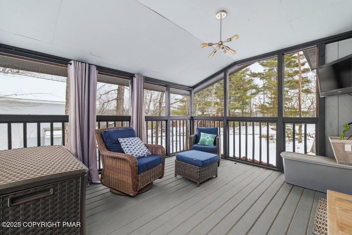 2260 Apley Court Bushkill, PA 18324 - Photo 24 of 44 a living room with furniture and a floor to ceiling window