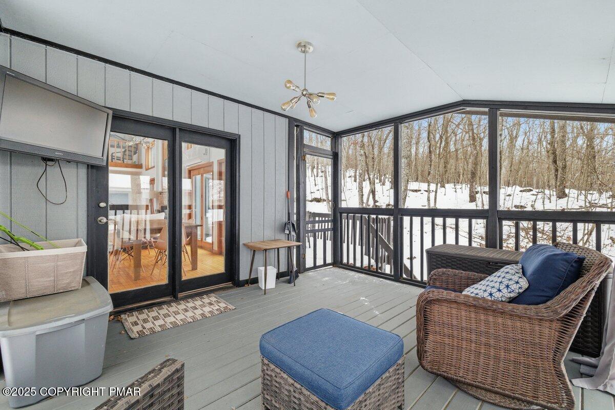 2260 Apley Court Bushkill, PA 18324 - Photo 25 of 44 a living room with furniture and a floor to ceiling window