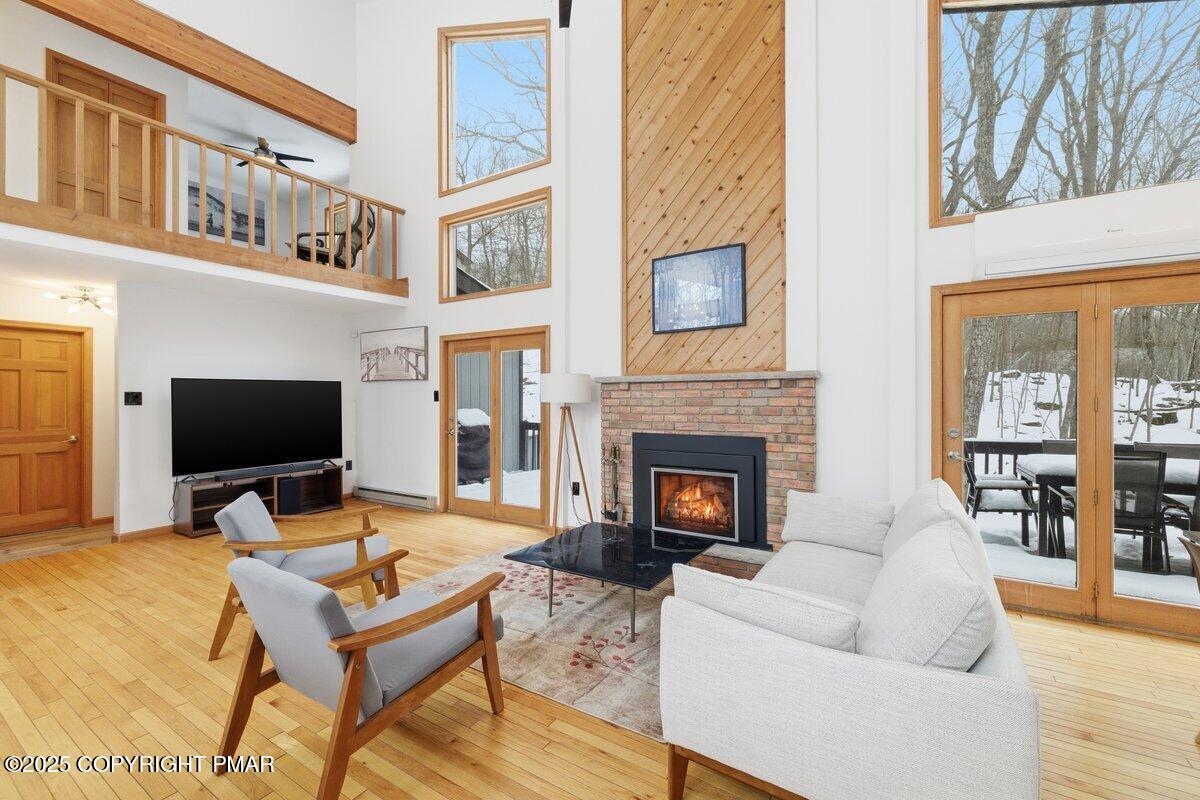 2260 Apley Court Bushkill, PA 18324 - Photo 3 of 44 a living room with furniture fireplace and flat screen tv