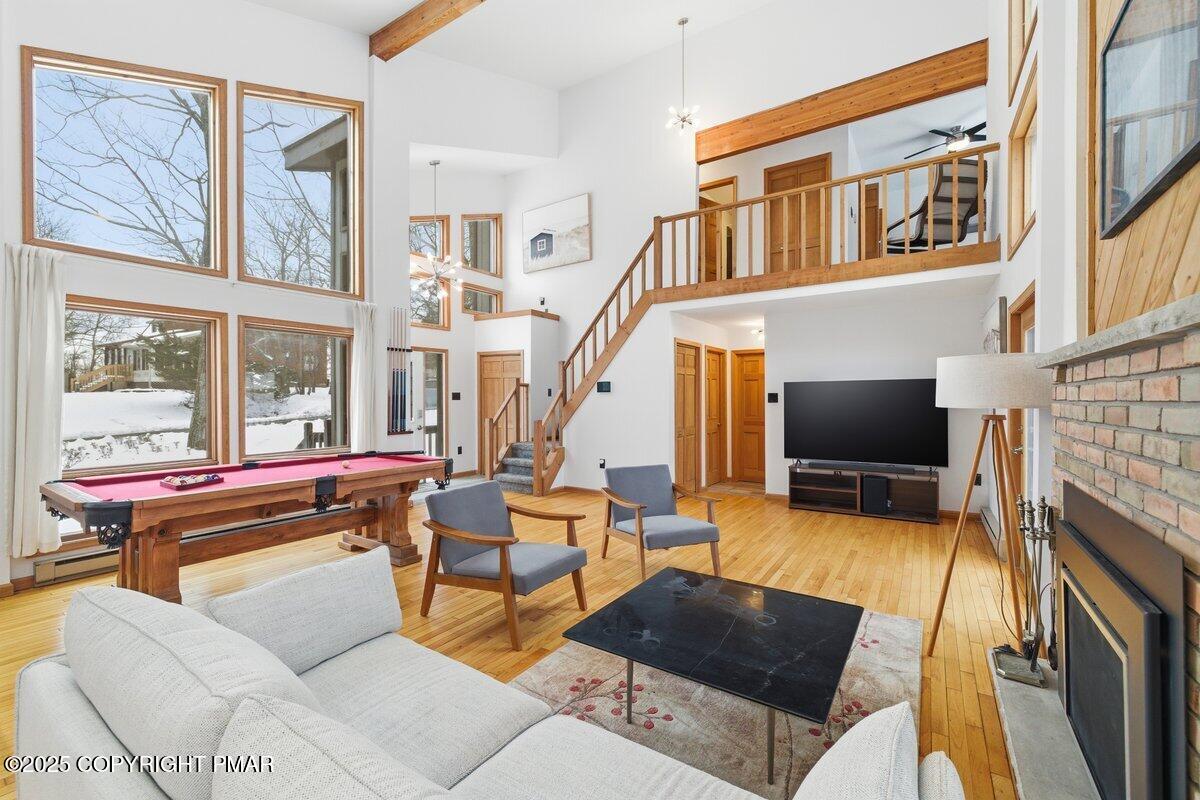 2260 Apley Court Bushkill, PA 18324 - Photo 41 of 44 a living room with fireplace furniture and a flat screen tv