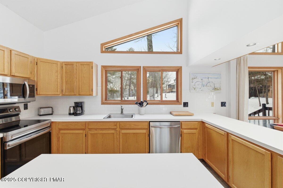 2260 Apley Court Bushkill, PA 18324 - Photo 6 of 44 a kitchen with a sink a stove and cabinets