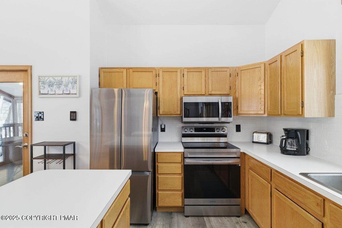 2260 Apley Court Bushkill, PA 18324 - Photo 7 of 44 a kitchen with stainless steel appliances a refrigerator stove and microwave