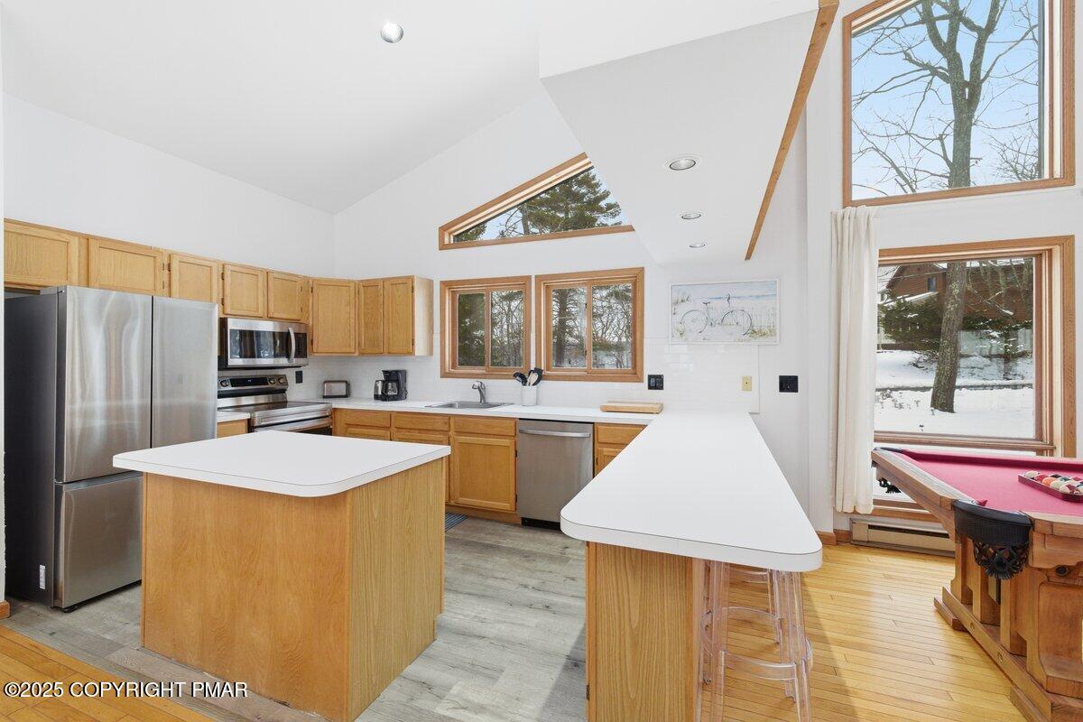 2260 Apley Court Bushkill, PA 18324 - Photo 8 of 44 a kitchen with stainless steel appliances granite countertop a sink and a refrigerator