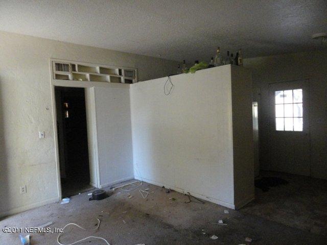 1420 King Arthur Road Jacksonville, FL 32211 - Photo 5 of 7 an empty room with wooden floor