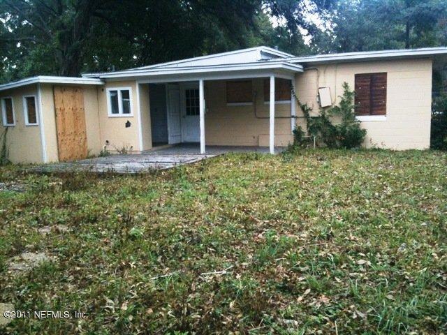 1420 King Arthur Road Jacksonville, FL 32211 - Photo 7 of 7 a view of a house with a backyard