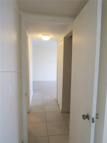 a view of hallway with shower