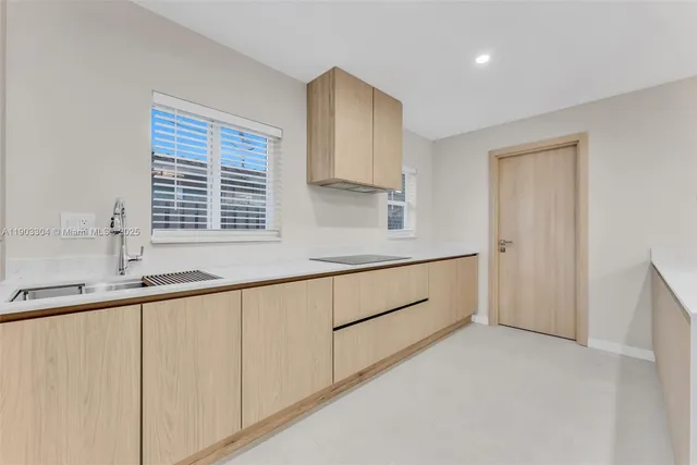 a bathroom with a sink and a window