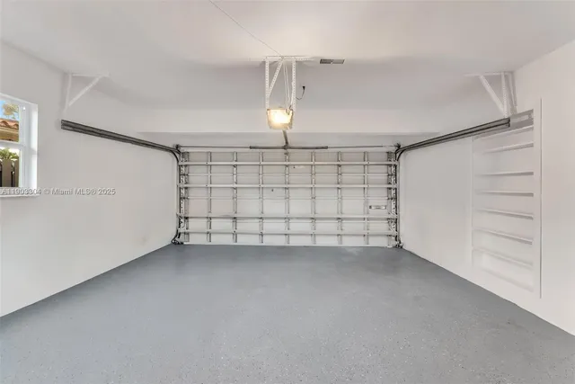 a spacious bedroom with a bed and a large window