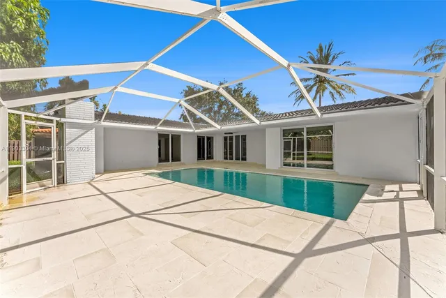 a view of a house with a backyard