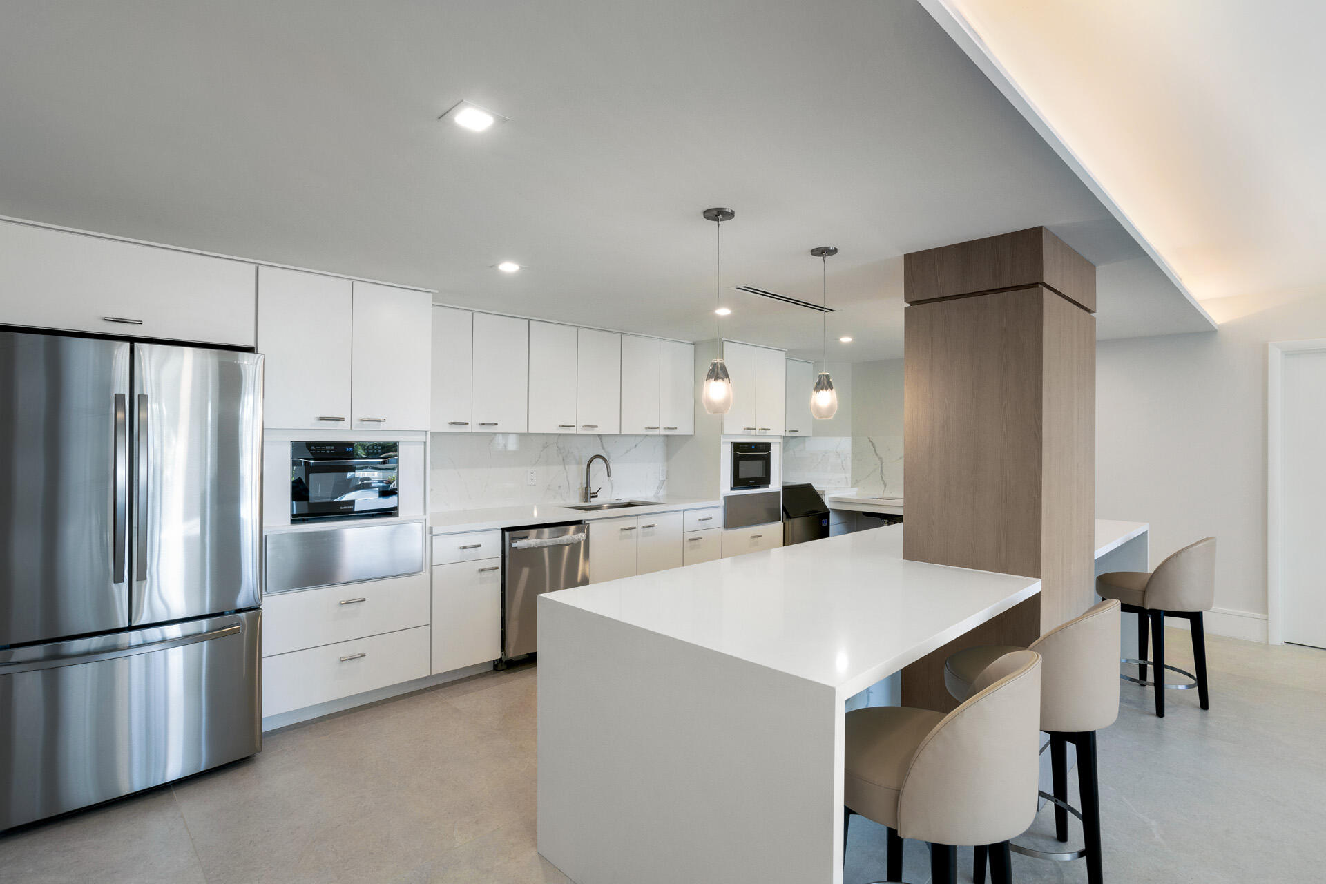 50 E Road, Unit 11G Delray Beach, FL 33483 - Photo 26 of 32 COMMON_AREA_KITCHEN_LEFT_ANGLE