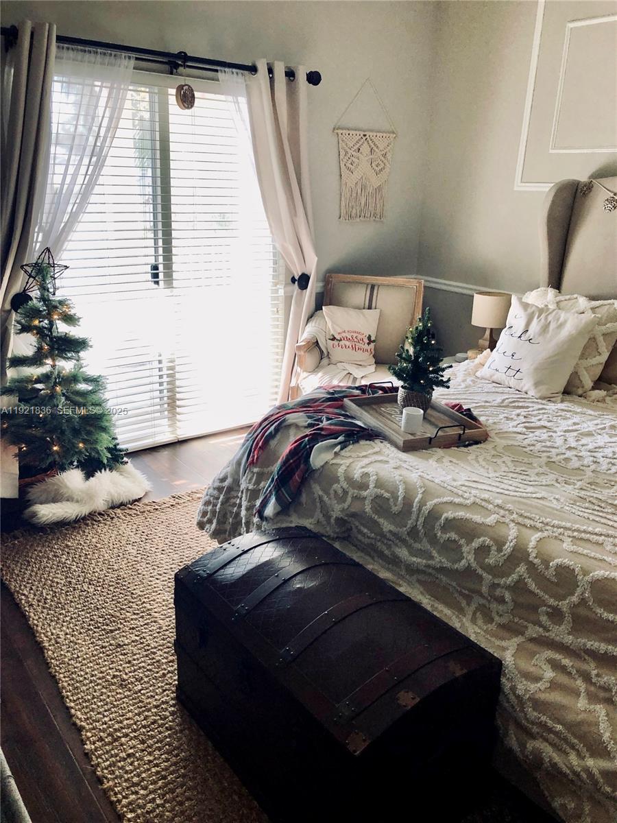 3121 Southeast 2nd Drive Homestead, FL 33033 - Photo 12 of 43 a bed sitting in a bedroom next to a window