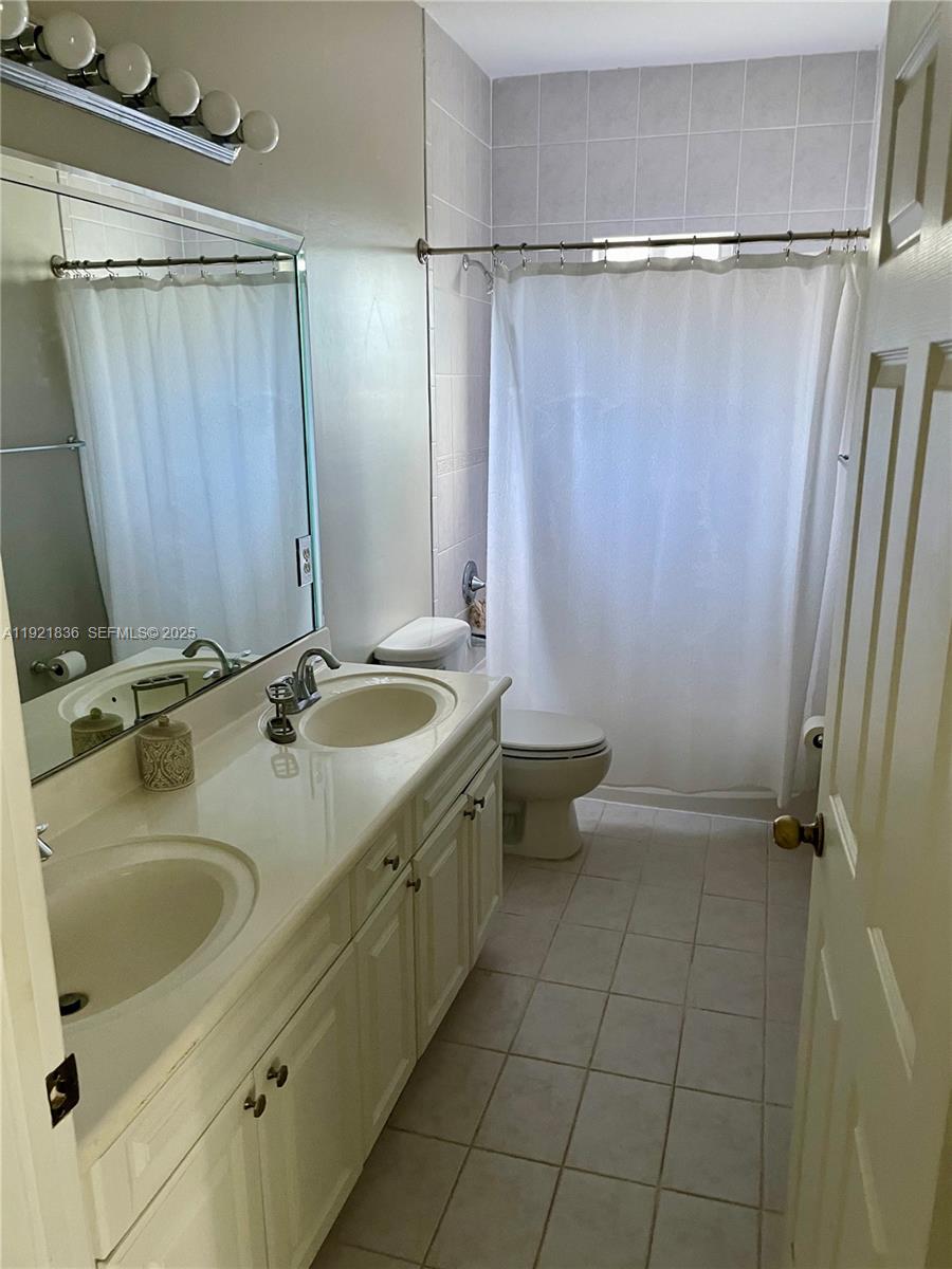 3121 Southeast 2nd Drive Homestead, FL 33033 - Photo 13 of 43 a bathroom with a sink toilet and shower