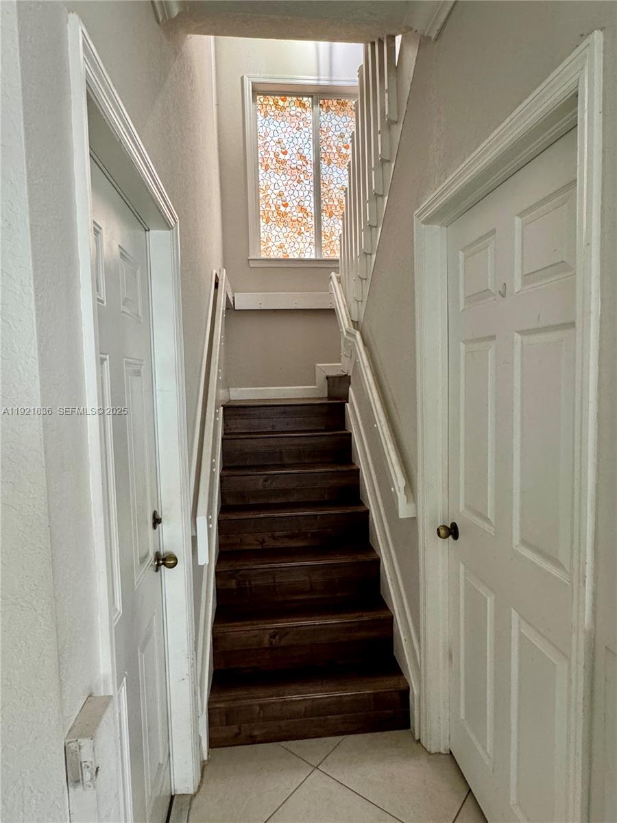 3121 Southeast 2nd Drive Homestead, FL 33033 - Photo 20 of 43 a view of entryway with wooden floor and stairs