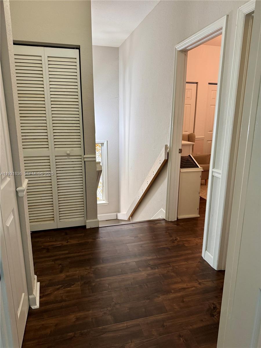 3121 Southeast 2nd Drive Homestead, FL 33033 - Photo 21 of 43 a view of an empty room with wooden floor and a window