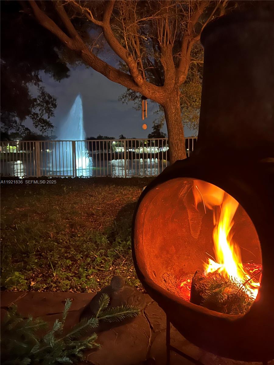 3121 Southeast 2nd Drive Homestead, FL 33033 - Photo 29 of 43 a view of a swimming pool with an outdoor space and seating area