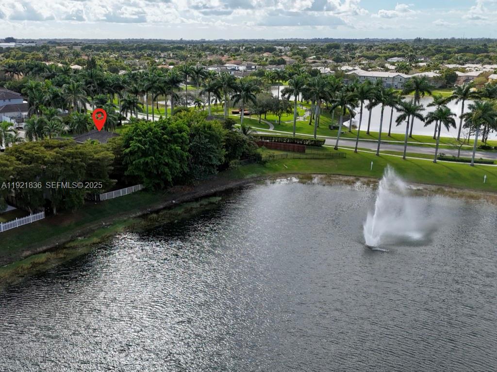 3121 Southeast 2nd Drive Homestead, FL 33033 - Photo 36 of 43 a view of a lake with a building in the background